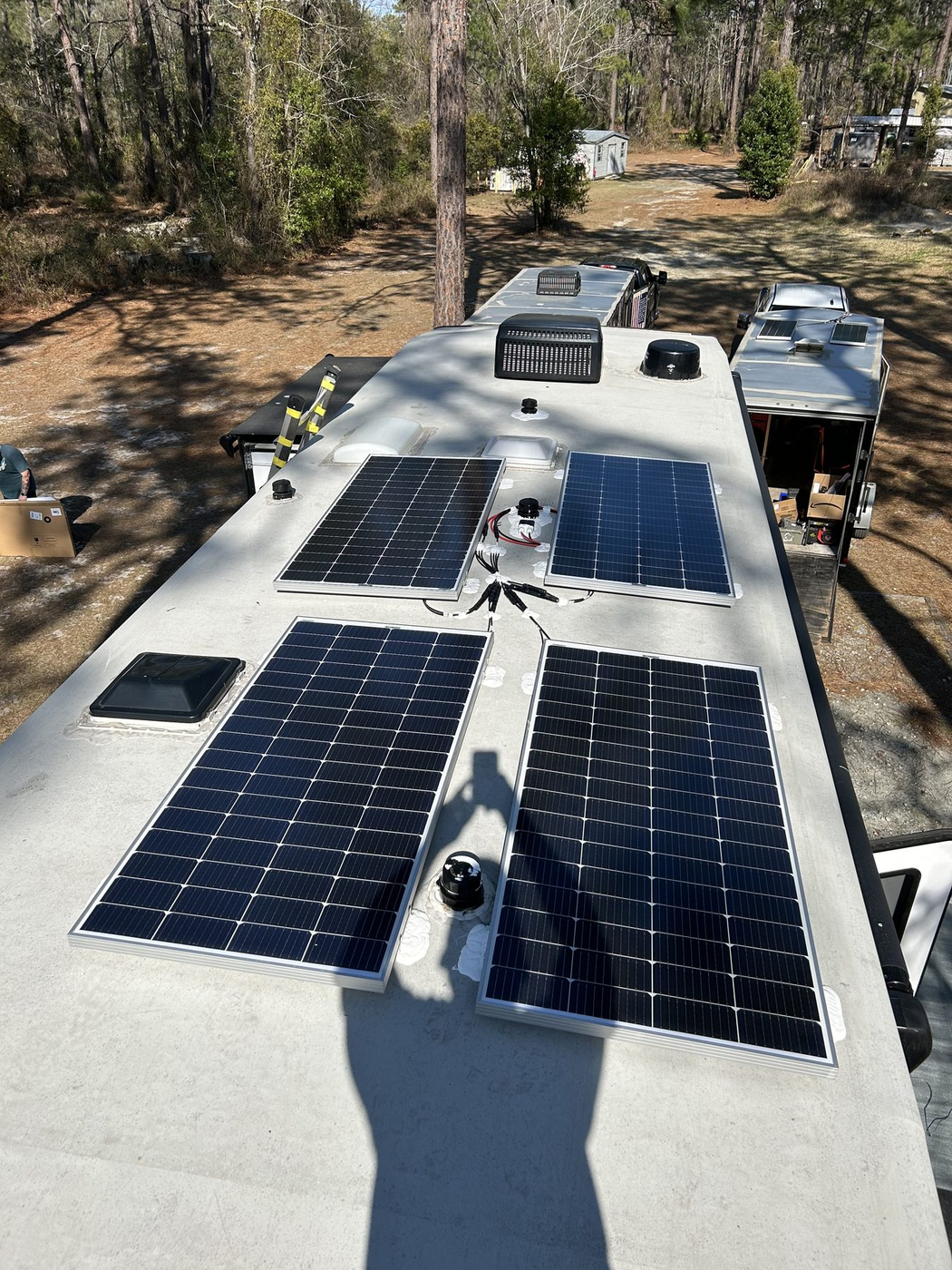 RV roof with solar panels vents and AC units